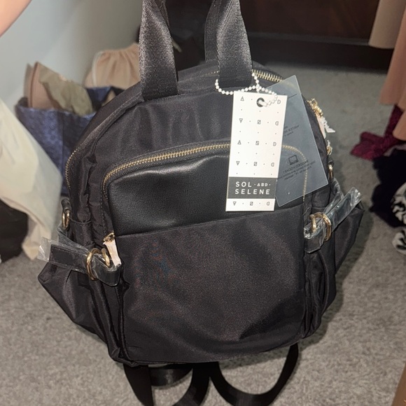 Sleek Black Backpack with Gold Zippers - Picture 2 of 10